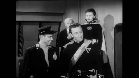 USA - 1954 - In this adventure sci-fi film, officers gather in the control room Stock Footage 327737500