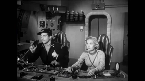 USA - 1954 - In this adventure sci-fi film, people in control rooms of Stock Footage 327745111