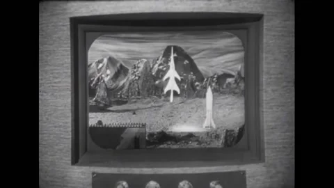 USA - 1954 - In this adventure sci-fi film, a woman points a ray gun at another Stock Footage 327745267