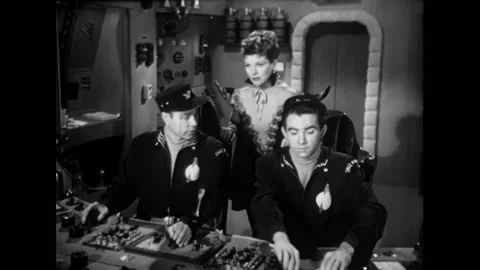 USA - 1954 - In this adventure sci-fi film, two men and women speak on a Stock Footage 327748273