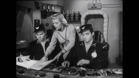 USA - 1954 - In this adventure sci-fi film, a woman brings a navigation chart to Stock Footage 327752166