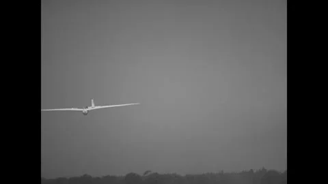 USA - 1955 - A glider pilot lands his aircraft while others enjoy ridge flying Stock Footage 341514914