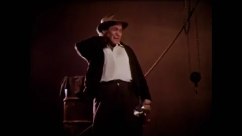 USA - 1956 - A construction worker finishes a clean-up job after an accident and Stock Footage 261574634