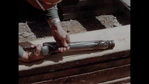 USA - 1957 - Close-up of a construction worker preparing a pneumatic drill on a 動画素材 340667224