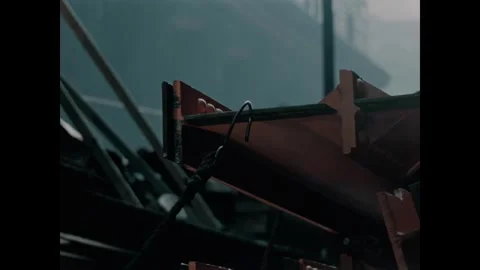 USA - 1957 - Construction workers put a hook onto a steel beam to steady a pile Stock Footage 340666991