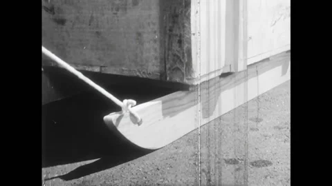 USA - 1958 - A boy pulls a sled with a box of comic books on top of it. Powdered Stock Footage 327751813