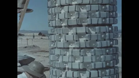 USA - 1958 - Men build a vertical tunnel for a fallout shelter at a desert Video stock 323259960