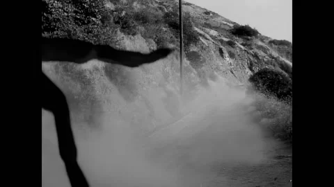 USA - 1958 - In this sci-fi horror movie, a man drives away from a giant Stock Footage 308177876