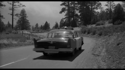 USA - 1958 - In this sci-fi horror, a policeman follows a car into a mountain Vidéo 323082561