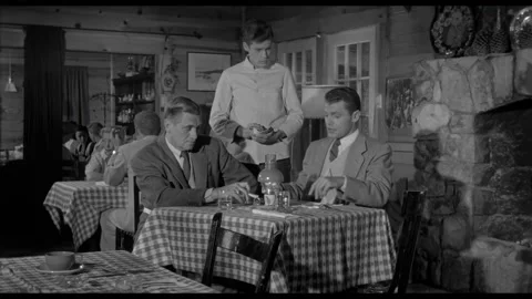 USA - 1958 - In this sci-fi horror, men sit at a table in front of a fireplace. Stock-Footage 323083059
