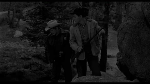 USA - 1958 - In this sci-fi horror, a man searches for a giant with a sheriff. 库存影片 323085142