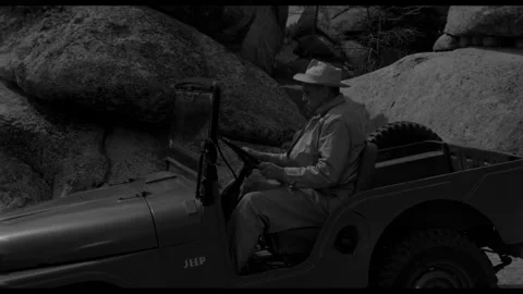 USA - 1958 - In this sci-fi horror, a man gets in a jeep but it wont start. A Video stock 323085955