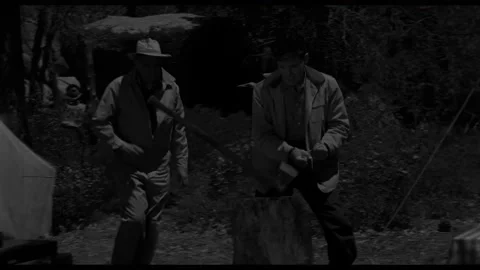 USA - 1958 - In this sci-fi horror, men run into a camp, one is handcuffed and 動画素材 323087162