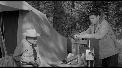 USA - 1958 - In this sci-fi horror, men meet at a campsite and talk about a dig 動画素材 323087765