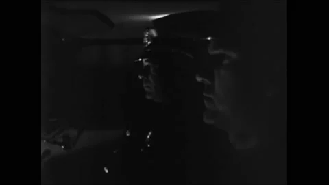 USA - 1960 - Cops answer a dispatch call from their car at night, which may Video stock 277343619