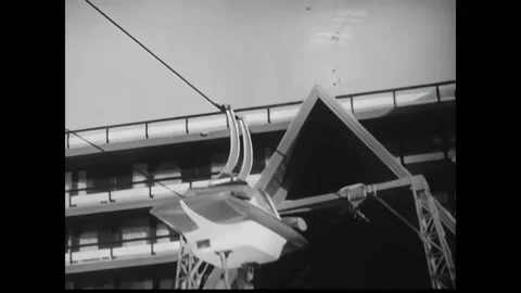 USA - 1960s - An angular ski lift is shown and skiers carry their skis to get Stock Footage 327745853
