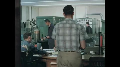 USA - 1960s - Engineers work on drafting in a factory. Stock Footage 340665525