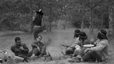 USA - 1962 - In this comedy, Native Americans dance and drum around a campfire Stock Footage 308174579