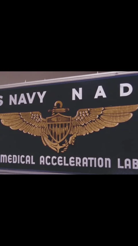 USA - 1963 - A US Navy pilot walks out of the Aviation Medical Acceleration Stock Footage 342652739