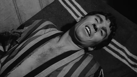 USA - 1964 - In this sci-fi horror movie, a beatnik screams after a flesh-eating Stock Footage 308630046