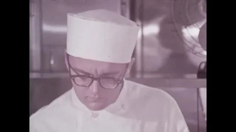 USA - 1966 - A chef breaks an egg single-handedly over the stove and has to try Stock Footage 340582768