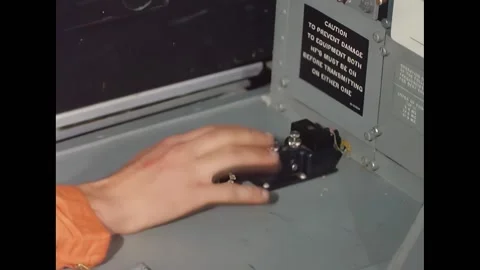 USA - 1966 - A man conveys a message using a Morse code machine, tapping out Stock Footage 296692926