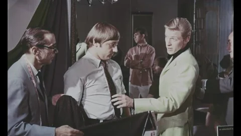 USA - 1967 - In this comedy, men speak in a tailor's office about making Stock Footage 341985992