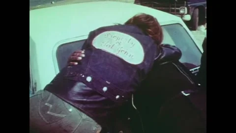 USA - 1969 - A biker whose gang is partying on the beach talks about the Stock Footage 259549564