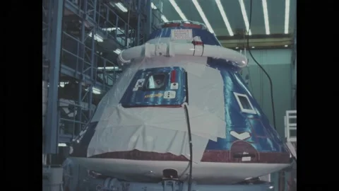 USA - 1969 - NASA technicians study the weight and balance of a command module. Video stock 313048611