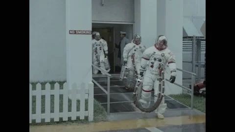 USA - 1970 - The Apollo 13 astronauts enter a special van for transport to a Stock Footage 312875993