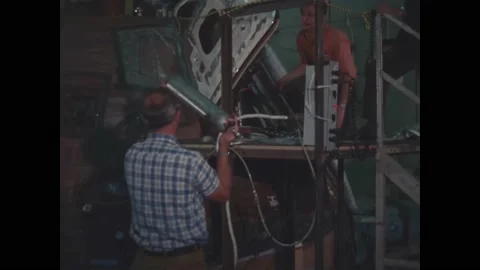 USA - 1970 - NASA technicians pass a gas sampling cylinder around to each other Stock Footage 313053553