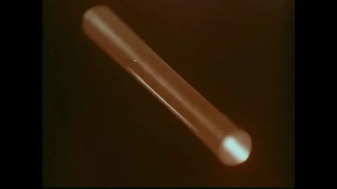 USA - 1970 - A ruby laser is displayed and explained. The laser punches through Stock Footage 328192963