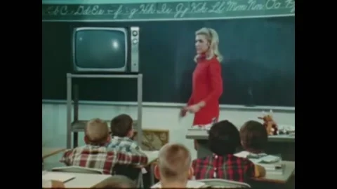 USA - 1970s - Elementary school students work on a math lesson after seeing a Stock Footage 264645891