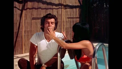 USA - 1972 - In this horror sci-fi, a man and woman smoke a marijuana joint at a 스톡 동영상 325204499