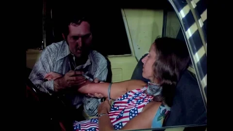 USA - 1972 - In this horror sci-fi, two people do heroin in a car. A mutated man 動画素材 325213239