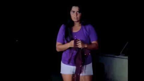 USA - 1972 - In this horror sci-fi, a woman in purple clothes watches a man slit Stockbeeldmateriaal 325217366