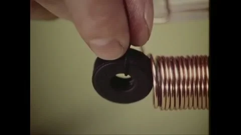 USA - 1972 - The magnetism of different objects is tested in an experiment. Stock Footage 264656679