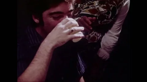 USA - 1972 - A man drinks alcohol before an experiment. Colorful images of Stock Footage 327751626