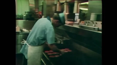 USA - 1974 - Employees work efficiently at McDonald's, the most successful fast Stock Footage 296400244