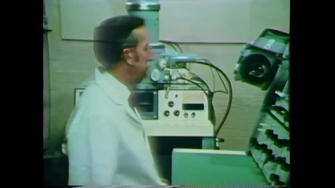 USA - 1974 - Myriad microscopic objects are studied under a scanning electron Stock Footage 296395000