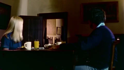 USA - 1977 - In this sci-fi horror, a priest comes to speak with a couple in a Video stock 327739475