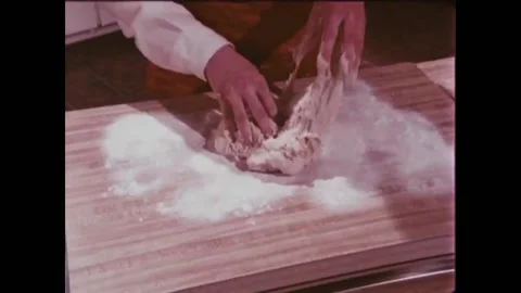 USA - 1981 - A baker demonstrates how to knead dough. Stock Footage 261572133