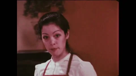 USA - 1981 - A baker shows how to make a drop batter for muffins, mixing the dry Stock Footage 261568665