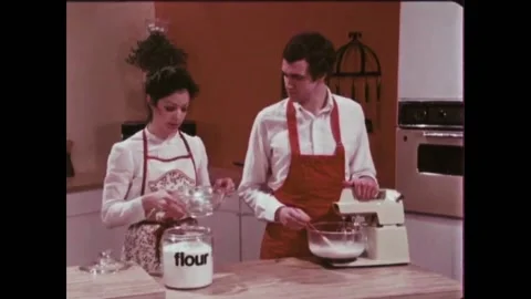 USA - 1981 - Bakers demonstrate how to add flour to a yeast bread dough while it Stock Footage 261569758