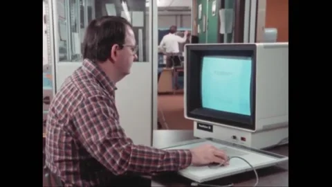 USA - 1984 - An old computer demonstrates initial processing, reflecting on how Stock Footage 296384083
