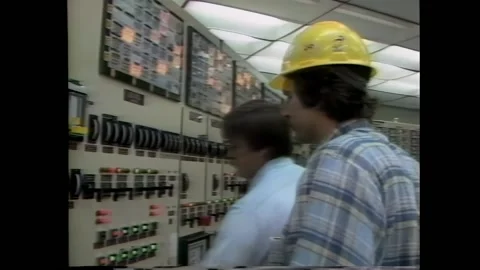 USA - 1984 - Radioactive material is lowered into a cooling tank at a nuclear Stock Footage 288083909