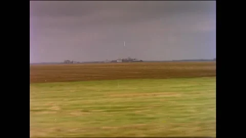 USA - 1985 - Views from an Amtrak train passing farmland, a waterfall, and Stock Footage 254194477