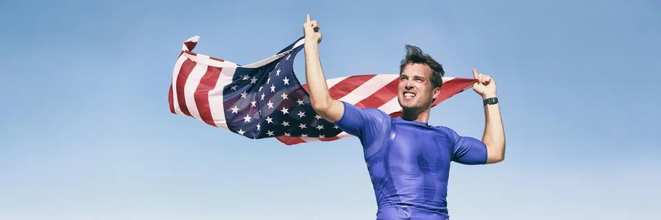 USA american athlete waving flag in success winning competition race on blue Stock Photos