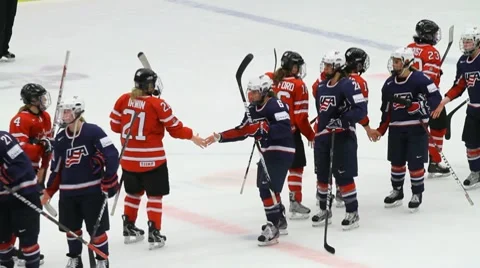 USA and Canada hockey teams shaking hands Stock Footage