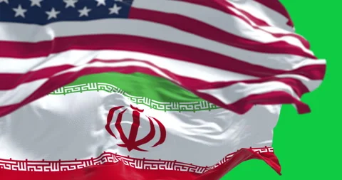 USA and Iran flags waving together isolated on green background Stock Footage 335880846